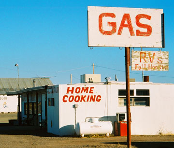 Photo of Hachita roadside scene with signs saying “Gas” and “Home Cooking”